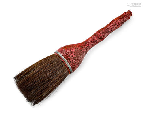 A carved cinnabar lacquer large brush or whisk