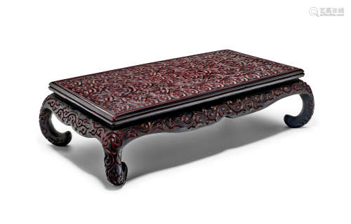 A Rare black and cinnabar tixi lacquer rectangular low table...