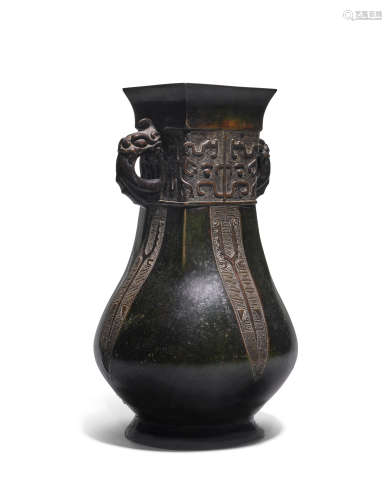 A rare silver-inlaid archaistic patinated bronze vessel