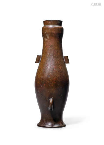 An unusual elongated oviform bronze two-handled vase