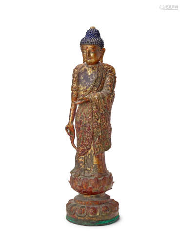 A Gilt lacquered bronze standing Buddha