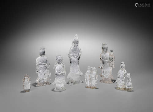 A group of six rock crystal figures and a miniature rock cry...