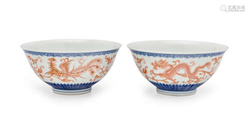 A pair of blue and white and iron red decorated bowls