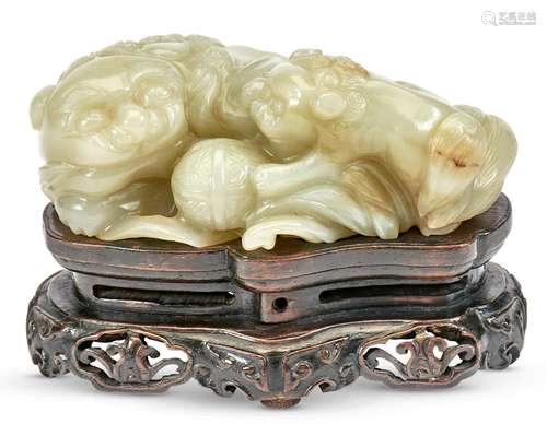 A Chinese Light Celadon Jade Fu Lion Grouping