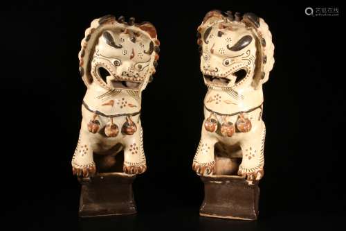 A Pair of Lion-shaped Candle Sticks
