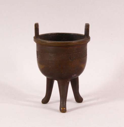 A SMALL 19TH CENTURY CHINESE TWIN HANDLE TRIPOD CENSER, the ...