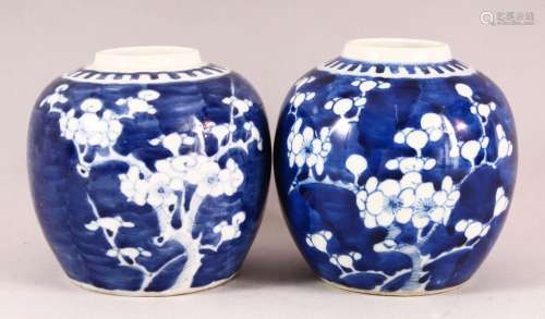 TWO CHINESE BLUE AND WHITE PRUNUS GINGER JARS, 13cm high.