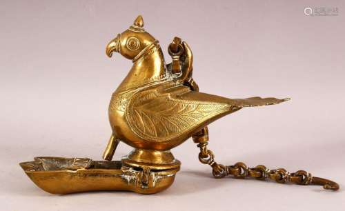 AN INDIAN BRASS HANGING LAMP in the form of a parrot, the hi...
