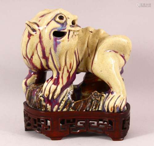 A CHINESE FLAMBE / CRACKLE GLAZE FIGURE OF A DOG & STAND...