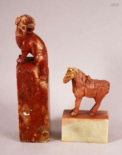 TWO CHINESE CARVED SOAPSTONE SEALS, one carved with lion dog...