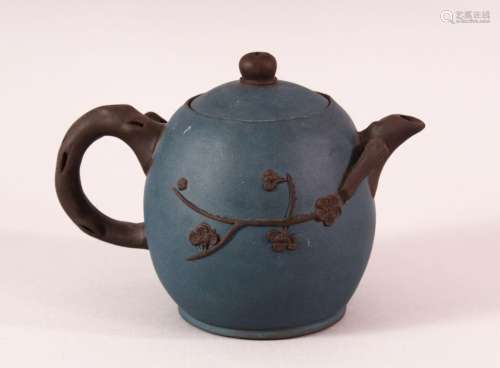 A CHINESE YIXING CLAY TEAPOT - with a blue ground and raised...