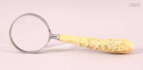 A 19TH CENTURY CARVED IVORY MAGNIFYING GLASS, carved with na...