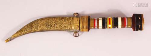 AN EASTERN HARDSTONE HANDLED BRASS SHEATH DAGGER - the hilt ...