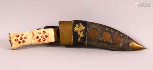 AN EASTERN CARVED BONE HANDLED DAGGER & LEATHER SHEATH, ...