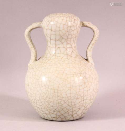 A CHINESE CRACKLE GLAZED PORCELAIN TWIN HANDLE VASE, the bas...