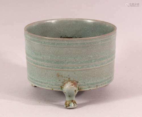 A CHINESE CELADON TRIPOD PORCELAIN CENSER - the body with a ...