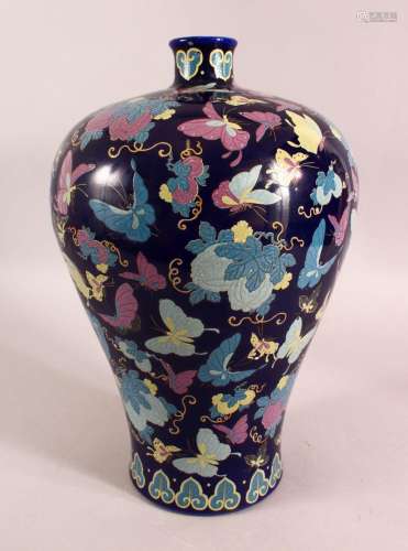 AN UNUSUAL CHINESE BLUE GROUND PORCELAIN BUTTERFLY VASE, the...