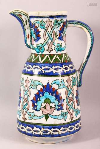 A GOOD IZNIK STYLE POTTERY EWER - finely decorated with colo...