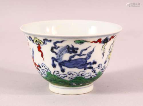 A CHINESE DOUCAI PORCELAIN HORSE CUP - depicting four horses...