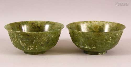 A GOOD PAIR OF CHINESE JADE BOWLS, the sides carved with ho-...
