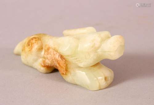 A CHINESE WHITE JADE CARVING in the form of an animal, 10cm ...