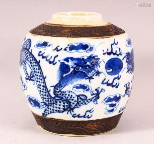 A 19TH CENTURY CHINESE BLUE & WHITE PORCELAIN DRAGON JAR...