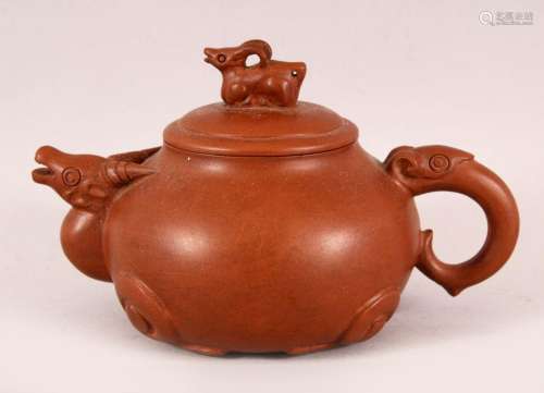 A CHINESE YIXING CLAY RAMS HEAD TEAPOT, in the form of a ram...