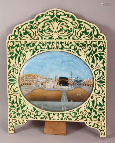 AN OVAL MINIATURE PAINTING OF MECCA ON CARD, displayed in a ...