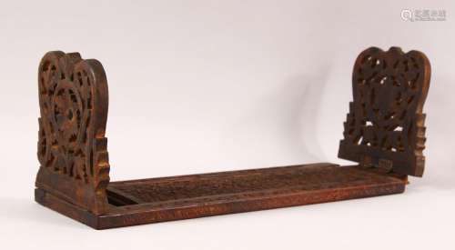 A 19TH CENTURY ISLAMIC CARVED WOOD BOOK STAND, with folding ...