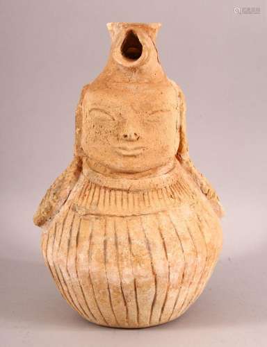 AN UNUSUAL EARLY SELJUK UNGLAZED POTTERY EWER, with the hand...