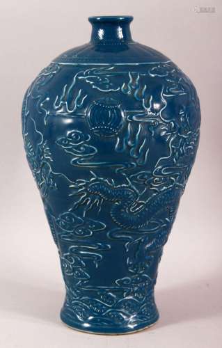 A CHINESE BLUE GROUND POTTERY DRAGON VASE, with dragons eith...