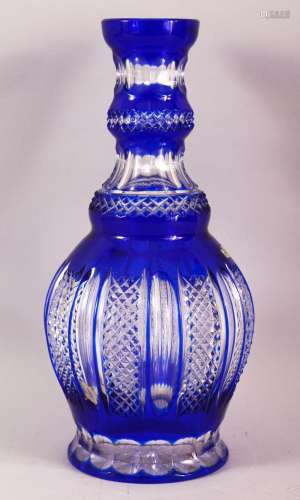 A LARGE ISLAMIC BLUE BOHEMIAN CUT GLASS HUQQA BASE, 34cm hig...