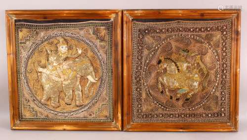 A PAIR OF FRAMED INDIAN EMBROIDERED PANELS, each centre with...
