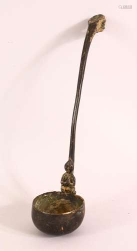 AN ARCHAIC STYLE BRONZE LADLE, the handle with dragon-like h...