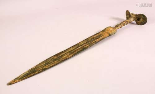 AN ARCHAIC STYLE BRONZE SHORT SWORD, with twisted handle and...