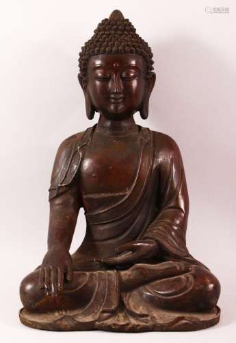 A LARGE CHINESE BRONZE BUDDHA, seated in the meditative posi...