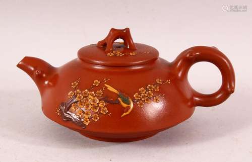 A CHINESE YIXING CLAY TEAPOT & COVER - decorated with ra...