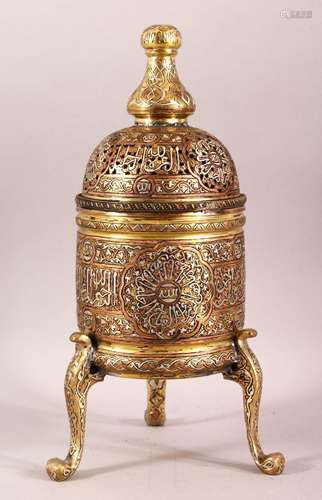 AN ISLAMIC SILVER AND COPPER INLAID BRASS INCENSE BURNER AND...