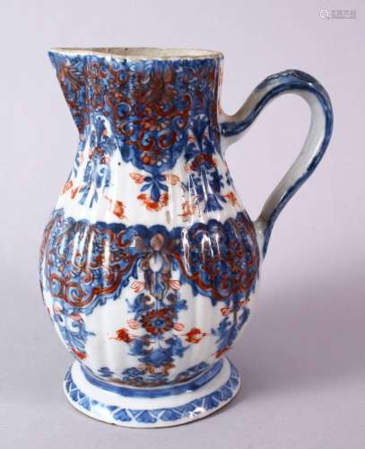 AN 18TH CENTURY CHINESE IMARI RIBBED PORCELAIN JUG, with und...