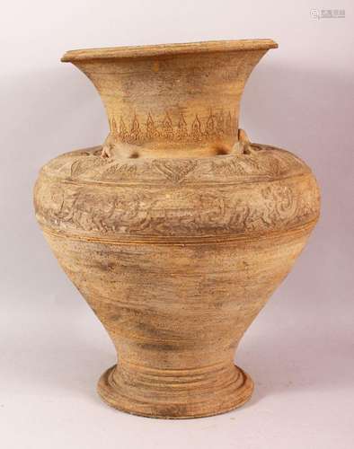 A LARGE EARLY ISLAMIC POTTERY VASE, the body with relief ban...