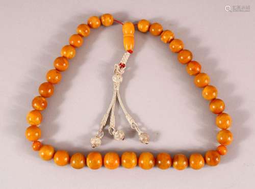 A FINE SET OF CHINESE OR ISLAMIC AMBER PRAYER BEADS, the str...