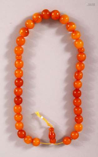 A GOOD SET OF CHINESE OR ISLAMIC AMBER PRAYER BEADS, the str...