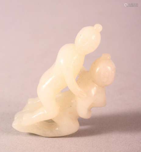 A EASTERN CARVED JADE PENDANT - EROTIC THEME - two figures d...