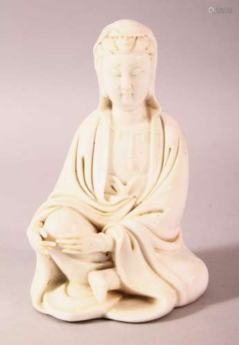 A CHINESE BLANC DE CHINE PORCELAIN FIGURE OF GUANYIN, in a s...