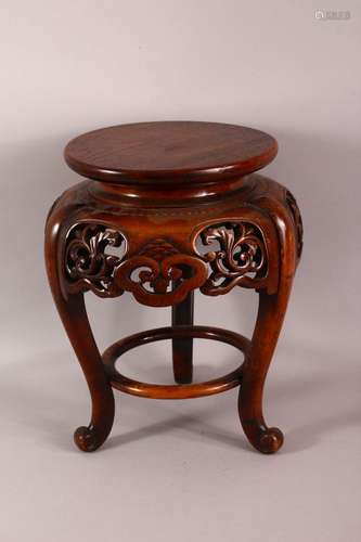 A JAPANESE CARVED HARDWOOD TRIPOD STAND - with a carved frie...