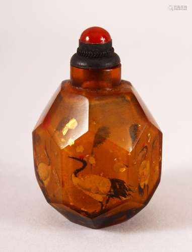 A CHINESE REVERSE PAINTED AMBER GLASS SNUFF BOTTLE - painted...