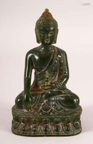 A THAI CARVED GREEN HARDSTONE BUDDHA, 13cm high.