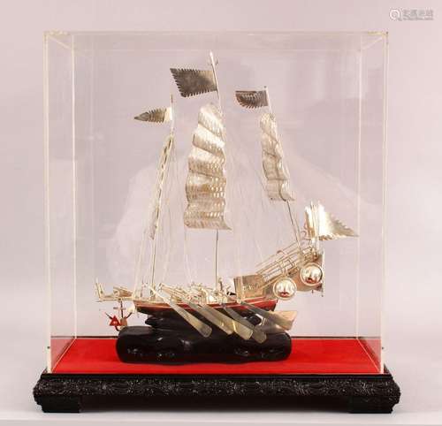 A 20TH CENTURY CHINESE SILVER MODEL OF A JUNK / SHIP - the s...