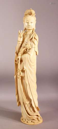 A SUPERB LARGE CHINESE IVORY TUSK CARVING OF A STANDING GUAN...