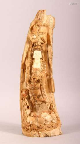 A CHINESE CARVED & STAINED IVORY FRAGMENT OF GUANYIN, th...